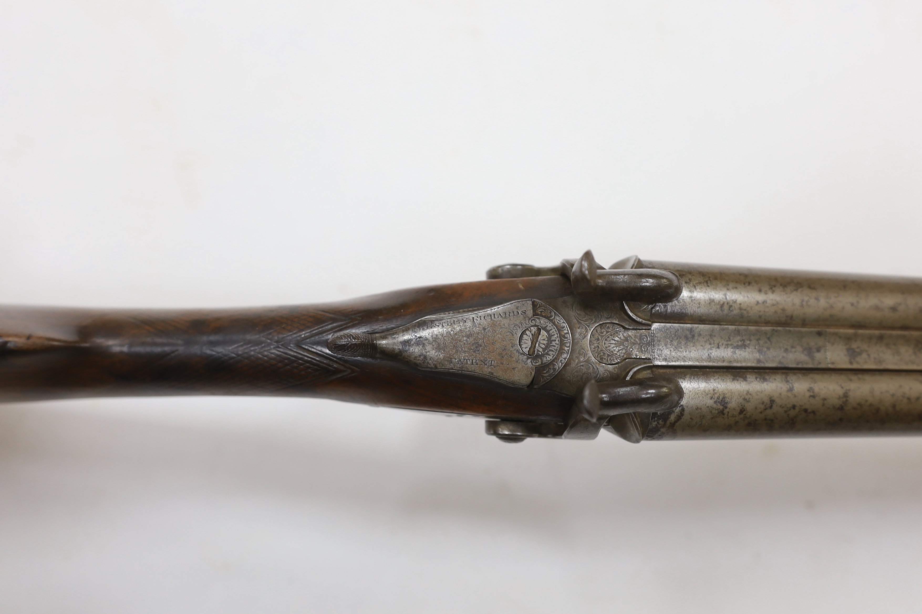 A double barrel pinfire shotgun by Wesley Richards with patent knuckle joint and top lever, barrels 74.5cm